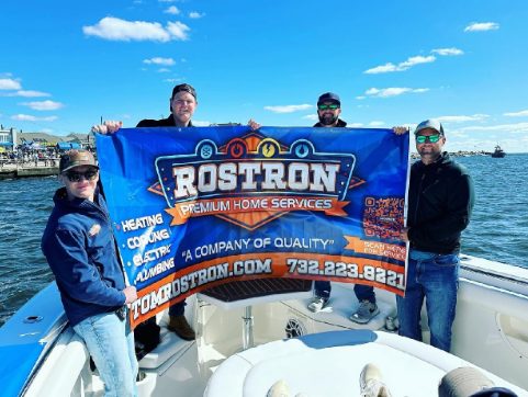 rostron employees on a boat